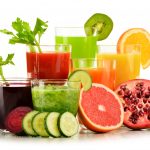 Glasses with fresh organic vegetable and fruit juices isolated on white. Detox diet.